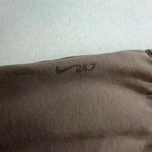 Nike Women's 24.7 ImpossiblySoft Dri-FIT 4'' Shorts HQ8179-233 Brown Large NWT thumbnail 8