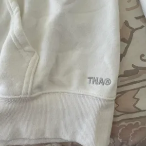 White TNA hoodie thumbnail 2