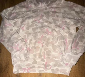abercrombie kids A&F Essentials Pink Camo Hoodie Size 13/14 Abercrombie Kids A&F Essentials hoodie in a pink and tan camo print. Size 13/14. Pullover style with kangaroo pocket, long sleeves, ribbed cuffs and hem. Gently used with minor wear, no holes, stains, or damage. thumbnail 3
