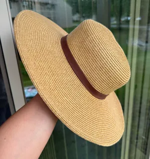 Something special wide brimmed straw hat with brown ribbon hand thumbnail 1