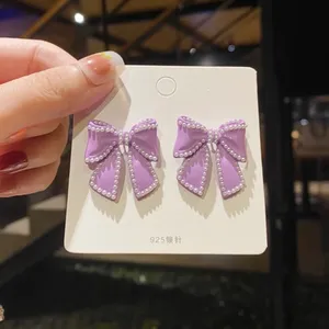Purple Bow Pearl Stud Earrings for Women thumbnail 1