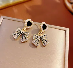 Gold Plated Bow Earrings thumbnail 1