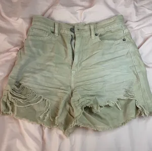 American Eagle High-waisted green denim shorts with frayed hem thumbnail 1