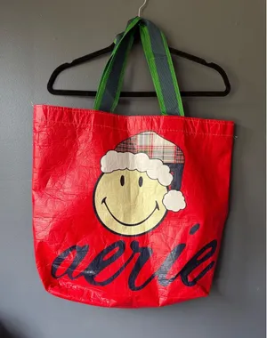 Aerie Red Holiday Tote Bag with Smiley Face and Plaid Santa Hat thumbnail 1