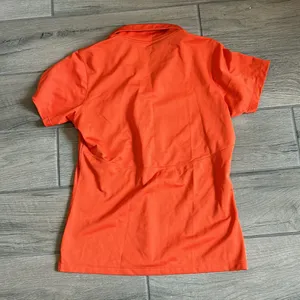 Sport tek orange polo shirt with dog embroidery thumbnail 4