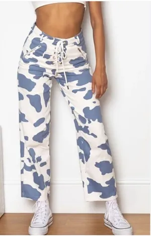 Beginning Boutique Tiger Lace Up Pants Cow Print thumbnail 1