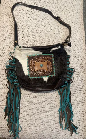 Myra Bag Black and White Cowhide Crossbody with Turquoise and brown Fringe thumbnail 1