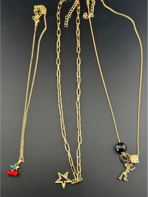 Set of 3 Gold Tone Charm Necklaces with Star, Dinosaur, Dice thumbnail 3