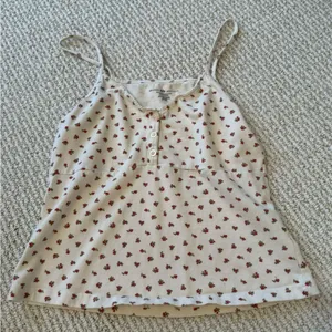 Brandy Melville Cream Tank Top with Red Floral Pattern thumbnail 1
