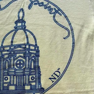 pastel yellow and blue Notre Dame knitting club shirt thumbnail 7