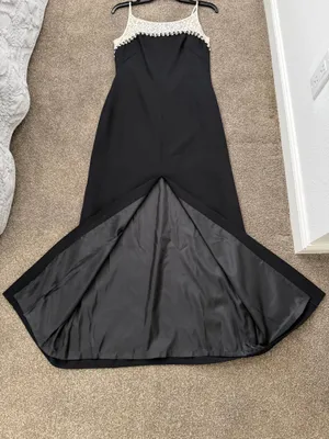Elegant black maxi dress featuring a delicate cream lace yoke and thin straps. thumbnail 10