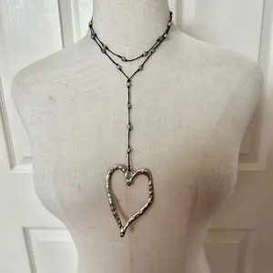 Silver tone long open heart necklace thumbnail 1