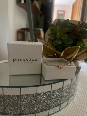 This is a Pura Vida bracelet featuring a dainty gold-tone wave charm thumbnail 3