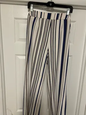 CHICO’S Stylish wide-leg pants in a navy and white striped pattern. Lightweight, flowy fabric for all-day comfort. Versatile design that dresses up or down. Easy to pair with tops and sandals. thumbnail 8