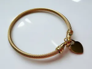 Gold heart cable bangle bracelet thumbnail 1