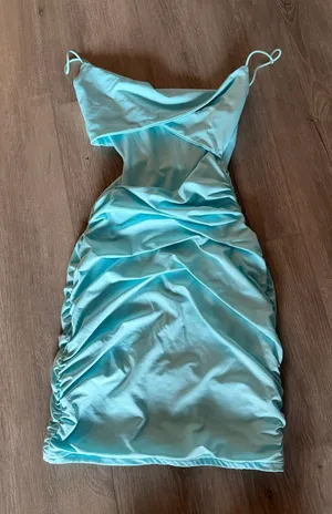 Like New Light Blue Cutout Ruched Mini Dress - Size XS Turn heads in this stunning light blue mini dress, perfect for your next night out, vacation, or special event. Features: Condition: Like new, excellent pre-owned condition. Design: Flattering ruched detailing, chic front cutout, and elegant twist-front bodice with thin straps. Fabric: Ultra-comfortable and stretchy blend of 95% Polyester and 5% Elastane that hugs your curves beautifully. Size: Women's XS. Fast shipping. Feel free to reach out with any questions or offers! thumbnail 1