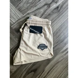 NEW Alphalete Woman’s Varsity Short - Tan ,size Medium thumbnail 6