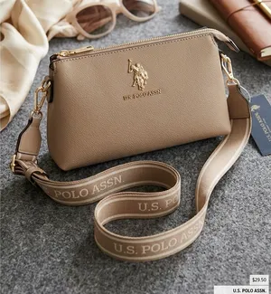 U.S. Polo Assn. Taupe Pebbled Leather Crossbody with Branded Web Strap thumbnail 1