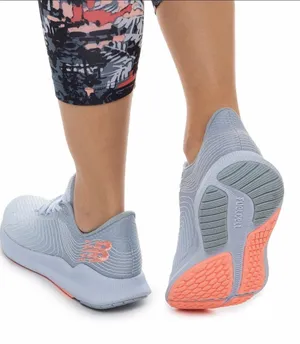 New Balance Women's Light Blue Sneakers with Coral Accents thumbnail 1