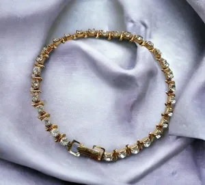 Gold rhinestone tennis bracelet thumbnail 1