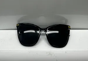 Stylish black sunglasses with gold accents. thumbnail 1