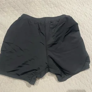 Brooks Women’s Fitted Black Athletic Running Shorts with drawstring and Logo thumbnail 2
