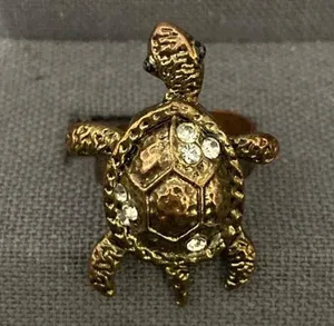 Vintage Bronze Turtle with Rhinestones Expansion Ring - size 7. can have bigger fingers to fit. Beautiful & fun conversation piece. Feet & tail move. Gently warn & Excellent condition. None smoking home. priced to sell at as is condition. Don’t like my price, make reasonable offer! And thank you for checking my closet. thumbnail 4