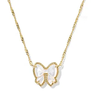 Kendra Scott Haley Bow Gold Pendant Earrings and Necklace thumbnail 6
