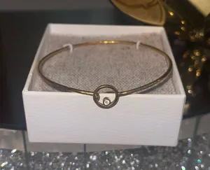 This is a Pura Vida bracelet featuring a dainty gold-tone wave charm thumbnail 1