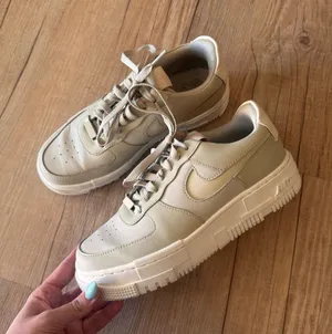 Nike Air Force 1’s Cream Low-Top Sneakers thumbnail 1