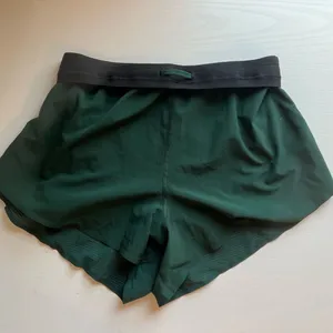 Athleta Interval Run Green Shorts XXS thumbnail 1