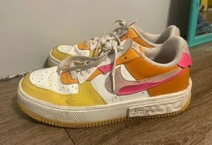 Pink orange and yellow Nike shoes thumbnail 1