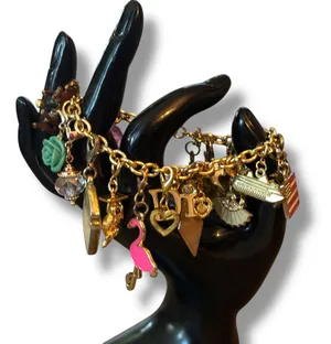 Gold tone loaded charm bracelet thumbnail 2