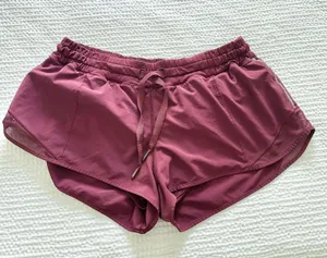  Lululemon maroon lined drawstring shorts with reflective striped sides   thumbnail 1