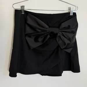 INA Black Big Bow Mini Skirt NWT size large thumbnail 1