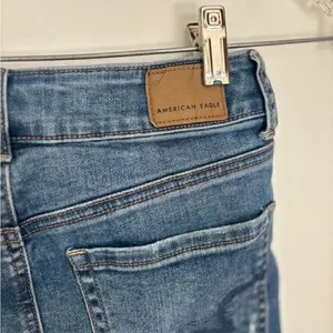 American Eagle Hi-Rise Mini Denim Jean Skirt Distressed Size 0 Blue thumbnail 8