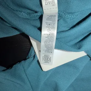 Women’s Athleta 5 Button Teal Pique Polo Size Medium NWT thumbnail 6