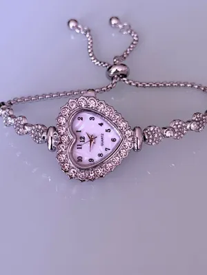 Brand New y2k Silver heart-shaped watch with rhinestone details and adjustable chain thumbnail 2
