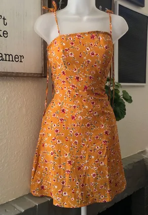 Floral mini dress with adjustable lace up tie knot straps with shirred back detail and invisible side zipper thumbnail 1