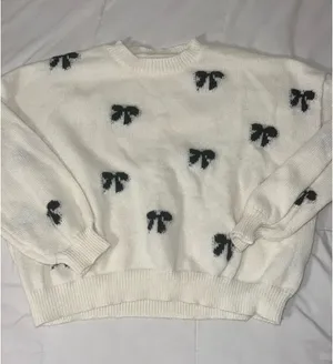 Cream sweater with black bows thumbnail 1