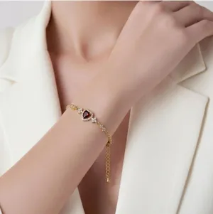 Gold Tone Chain Bracelet with Heart-Shaped Red Stone and Crystal Accents thumbnail 1