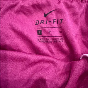 Nike Women's Magenta Athletic Running Shorts with Pink Swoosh size medium thumbnail 3