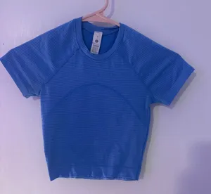Lululemon Swiftly Tech Cropped T-Shirt 💗 Size:0 In excellent condition with no stains, holes, or tears. Only worn a few times and still looks great! This top is lightweight, breathable, and perfect for workouts, cheer, running, or everyday wear. ✨ Details: * Authentic Lululemon * Swiftly Tech fabric * Cropped length * Smoke-free home * Ready to ship! Feel free to . 😊 thumbnail 1