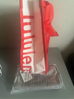 lululemon light grey travel pouch with red packing sleeve thumbnail 6