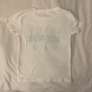 Brandy Melville New York Baby Tee John Galt thumbnail 2