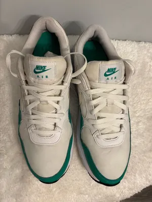 Green and white Nike Sz. 12 athletic or casual running shoes thumbnail 1