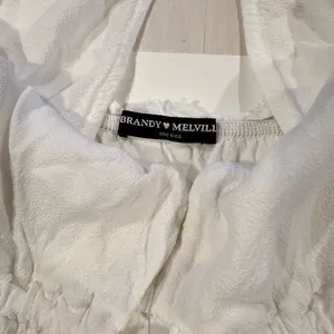 brandy melville riley babydoll flowy white tank top thumbnail 5