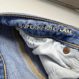 American Eagle Stretch Super Hi-Rise Flare Medium Wash Distressed Casual Size 8 thumbnail 11