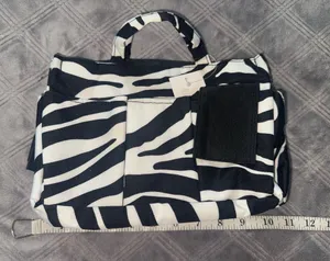Zebra print organizer bag with handle and pocket thumbnail 1