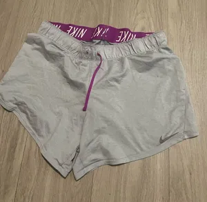 Nike Women's Light Gray Athletic Shorts with Purple Waistband and Drawcord thumbnail 1